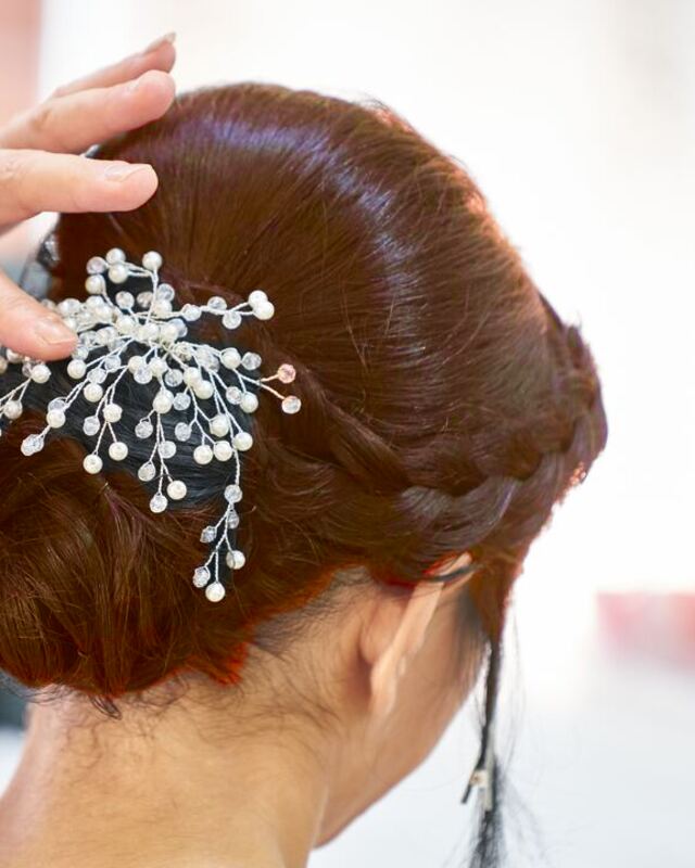 The same updo in auburn, made with LooksAI